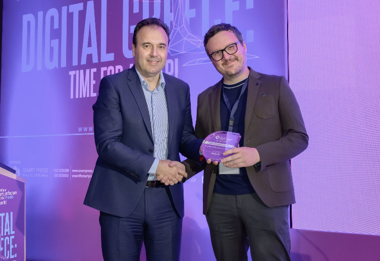 Morrow District founder receiving the Business Excellence in AI Services award from the Greek Ministry of Digital Governance at the Digital Greece conference.